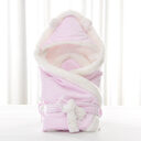 Newborn baby being hugged and swaddled