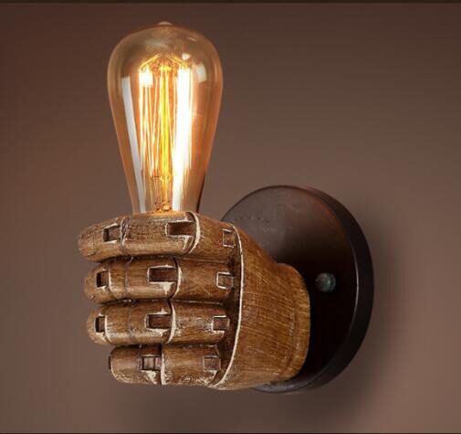 Fist resin wall lamp creates decorative
